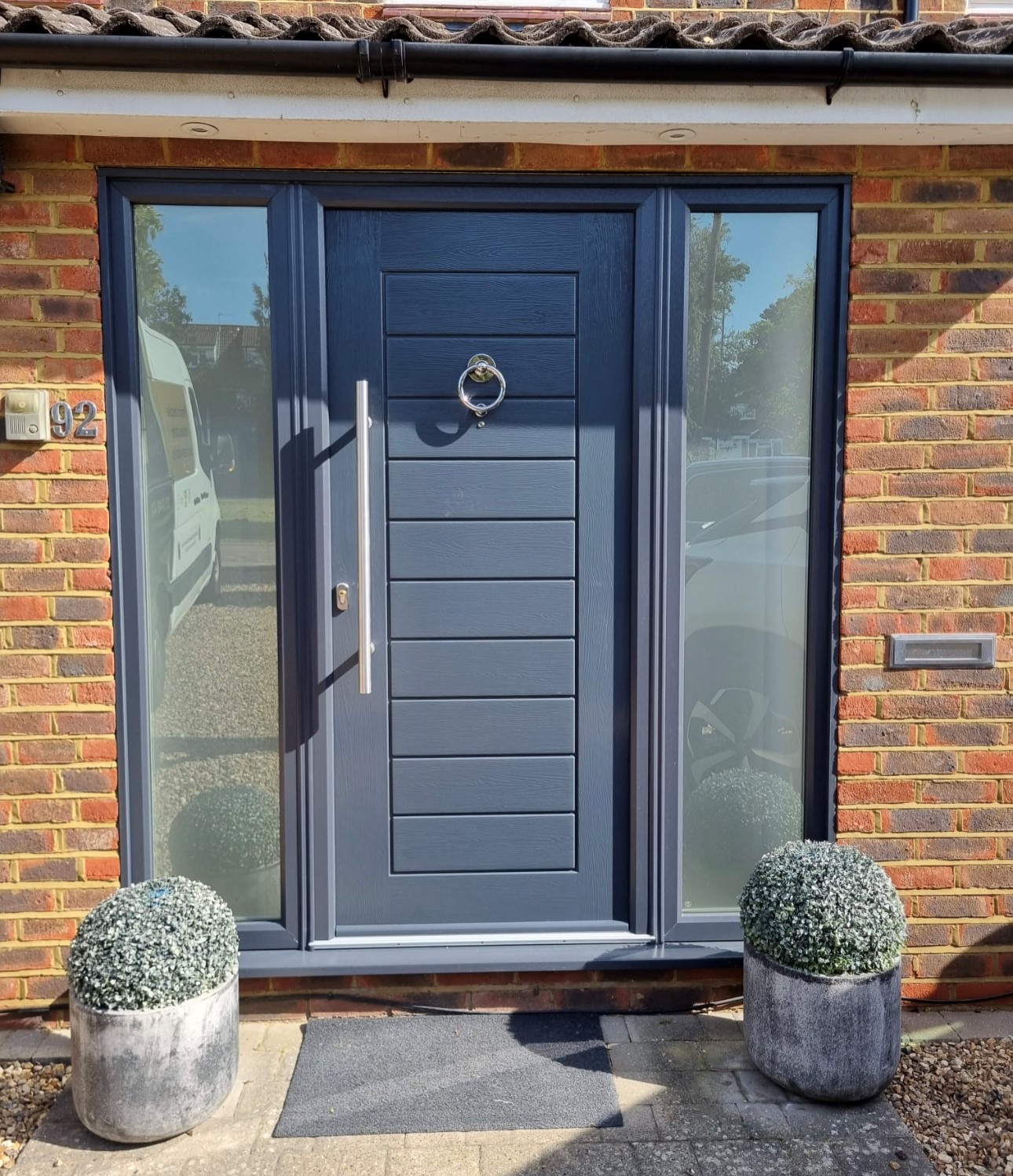Classic Solidor front door with decorative glass side panels